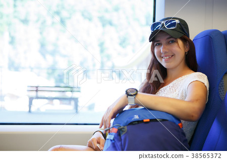 Picture of smiling girl at train station Picture of smiling girl at train station 38565372