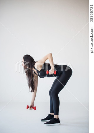 Full-length side view of the fitness girl doing Full-length side view of the fitness girl doing 38566721