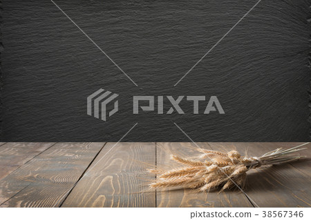 Kitchen background. Tabletop with wheat on board. Kitchen background. Tabletop with wheat on board. 38567346