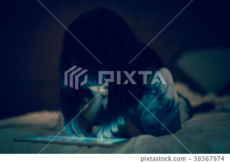 Kid using internet faced with cyberbullying. 38567974
