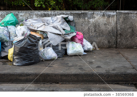 Road and footpath full of garbage / Dirty street. Road and footpath full of garbage / Dirty street. 38569368