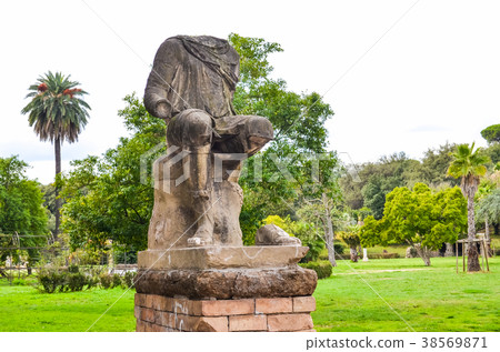 Antique ruined statue in park in Rome, Italy 38569871