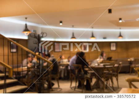 Blurred abstract restaurant background. Warm Blurred abstract restaurant background. Warm 38570572