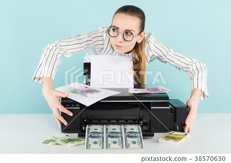 Attractive woman printing cash 38570630
