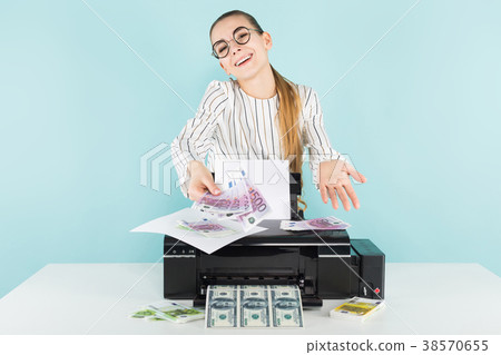 Attractive woman printing cash 38570655