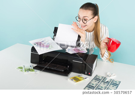 Attractive woman printing cash 38570657