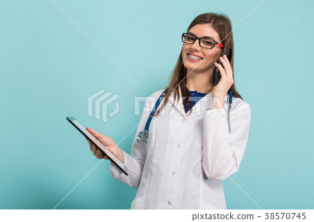 Female doctor with tablet and smartphone Female doctor with tablet and smartphone 38570745