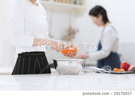Mother and girl cooking Mother and girl cooking 38570857