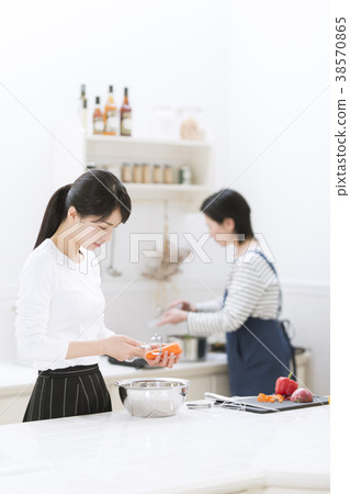 Mother and girl cooking 38570865