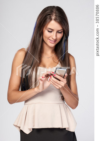 Woman using smartphone Woman using smartphone 38570886