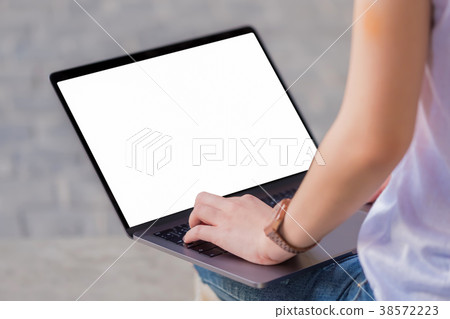 Woman using a laptop,Women sit on floor. 38572223