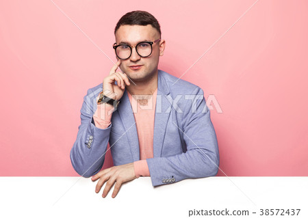 Handsome man in bright jacket with white banner Handsome man in bright jacket with white banner 38572437