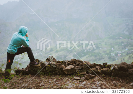 Traveler on the edge in of rural landscape with 38572503