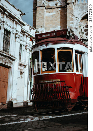 Quaint tram passes directly in front of the Se 38572509