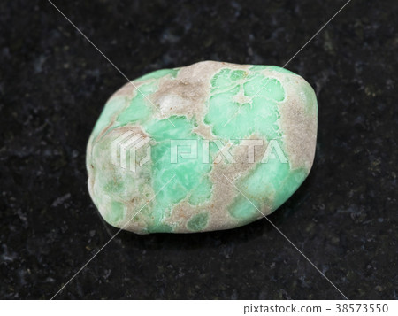 polished Variscite gemstone on dark background polished Variscite gemstone on dark background 38573550