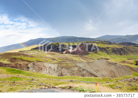 rainbow in mountains in Hveragerdi, Iceland 38573717