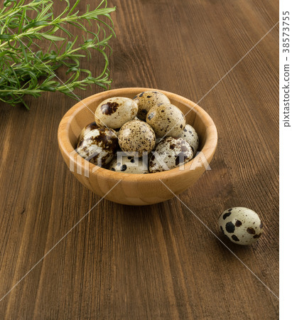 Quail Eggs on Wooden Background 38573755