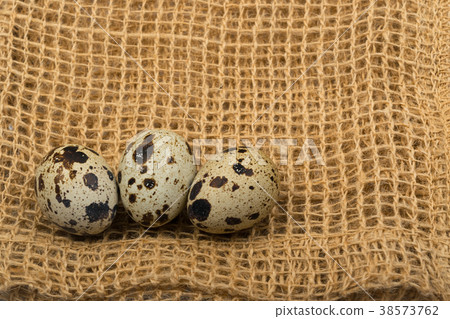 Quail Eggs on Rustic Background 38573762