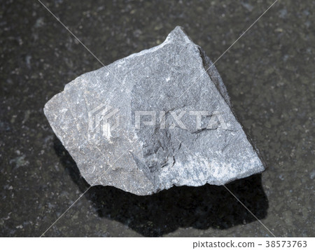 raw argillite stone on dark background 38573763