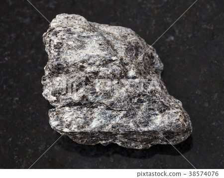 rough quartz-biotite schist stone on dark rough quartz-biotite schist stone on dark 38574076