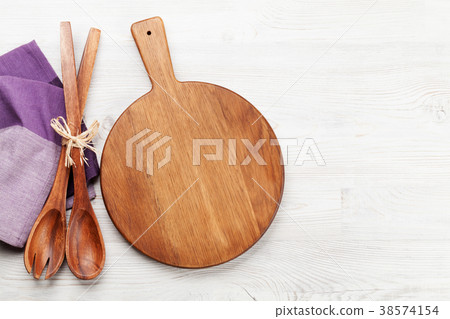 Cutting board over wooden table 38574154