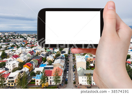 tourist photographs street in Reykjavik city 38574191
