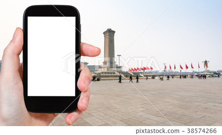 tourist photographs Tiananmen Square in Beijing 38574266
