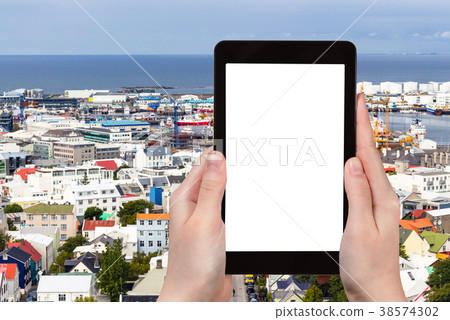 tourist photographs harbor in Reykjavik city tourist photographs harbor in Reykjavik city 38574302