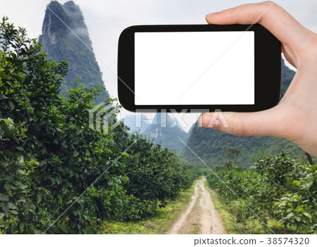 tourist photograps road to karst peaks in Yangshuo 38574320
