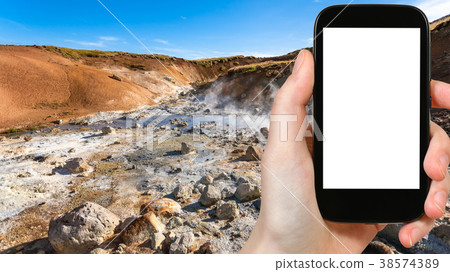 tourist photographs acidic springs in Krysuvik tourist photographs acidic springs in Krysuvik 38574389