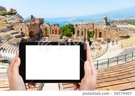 people in Teatro antico di Taormina in summer 38574407