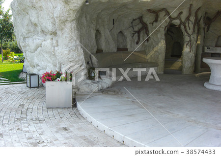 Artificial cave in the garden as outdoor kitchen Artificial cave in the garden as outdoor kitchen 38574433