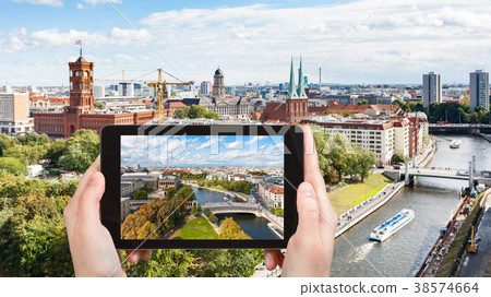 tourist photographs Berlin city with Spree river 38574664