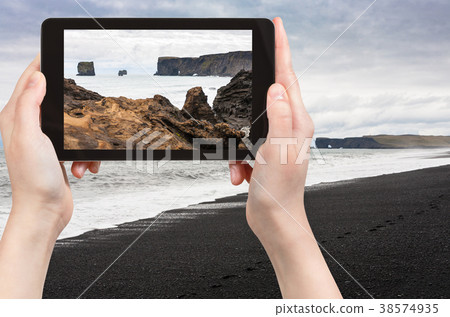 tourist photographs Atlantic ocean volcanic coast tourist photographs Atlantic ocean volcanic coast 38574935