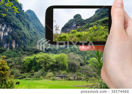 tourist photographs karst mountains in Yangshuo 38574988