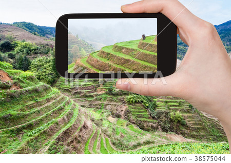 tourist photographs terraced fields near Dazhai tourist photographs terraced fields near Dazhai 38575044