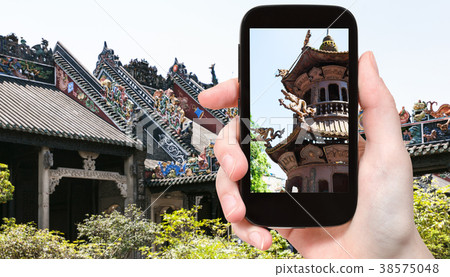tourist photographs outdoor altar in Temple 38575048