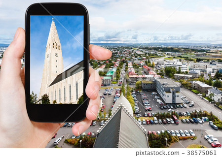 tourist photographs church in Reykjavik city 38575061