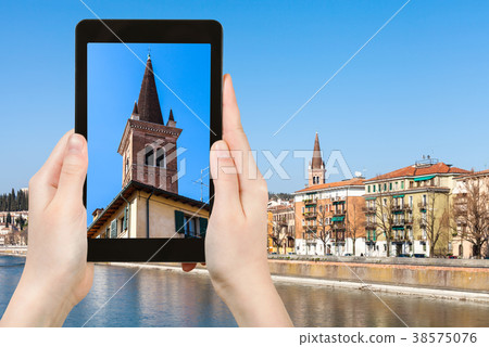 tourist photographs church tower in Verona tourist photographs church tower in Verona 38575076