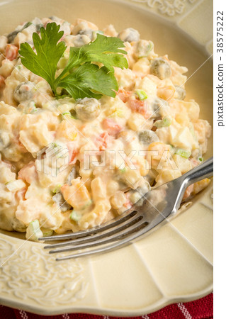 Traditional Russian vegetable salad. 38575222