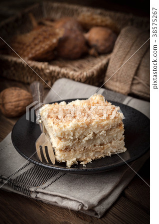 Homemade cake with ground walnut and coconut. Homemade cake with ground walnut and coconut. 38575267