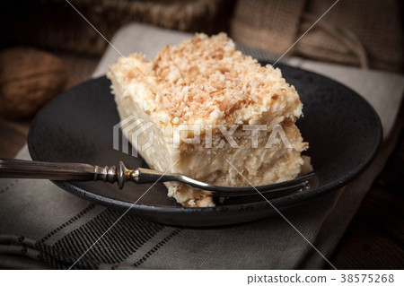 Homemade cake with ground walnut and coconut. Homemade cake with ground walnut and coconut. 38575268