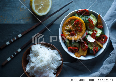 Rice, pickled vegetables and chopsticks. Asian Rice, pickled vegetables and chopsticks. Asian 38576074