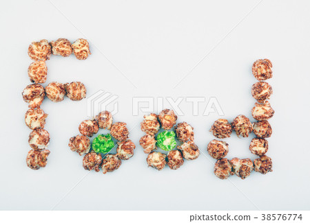 Pop Corn text wooden background Pop Corn text wooden background 38576774