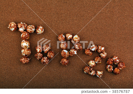 Pop Corn text wooden background Pop Corn text wooden background 38576787