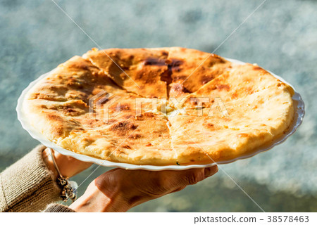 Caucasian khychin bread pie with meat close 38578463