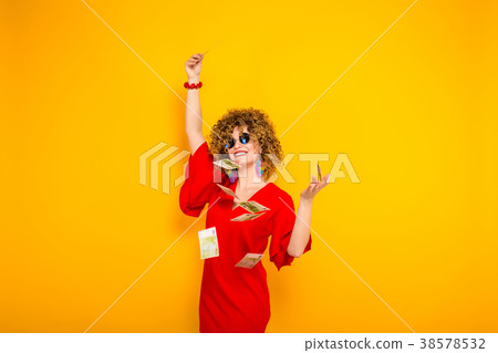 Attractive woman with short curly hair with cash 38578532