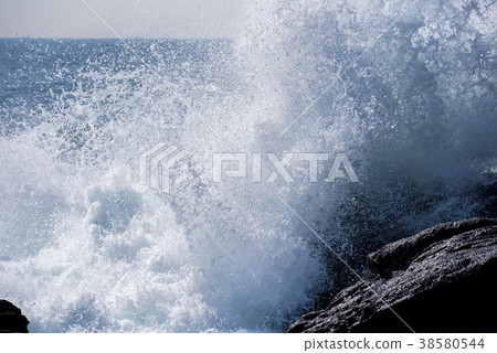 Rough waves crashing into rocks Rough waves crashing into rocks 38580544