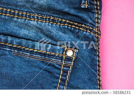 Jeans trousers on pink, flat lay Jeans trousers on pink, flat lay 38586231