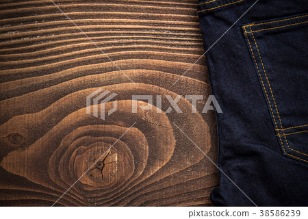 Dark jeans on wooden board Dark jeans on wooden board 38586239